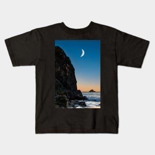 Moon over a rock and ocean Kids T-Shirt